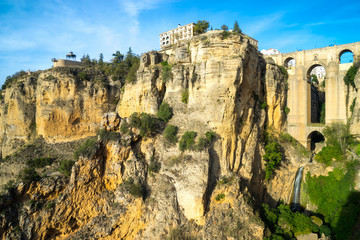 New bridge in Ronda, one of the famous white villages in Andalusia, Spain. The picture was taken during a golden sunset