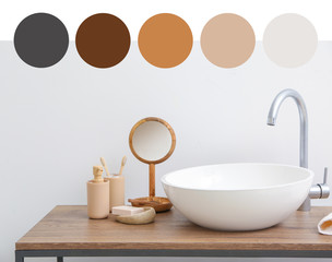 Body care cosmetics with accessories near sink in bathroom. Different color patterns
