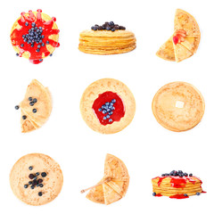 Set of tasty blini with berries on white background