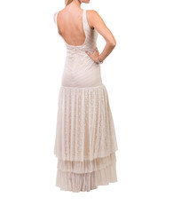 Beautiful woman dressed in evening gown over white background