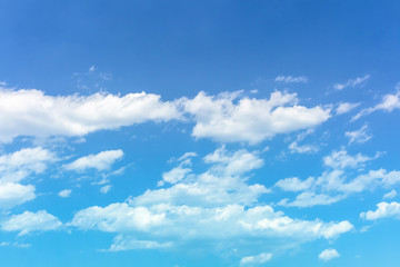 Naklejka na ściany i meble Color blue sea sky with fluffy clouds