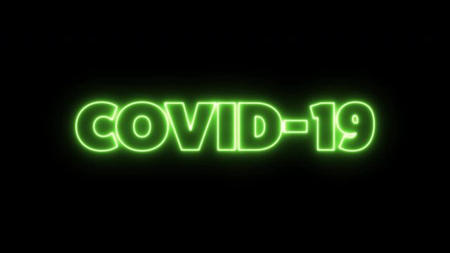 COVID-19 text word written in green neon letters on a black background. Animated Graphic motion design illustration advertising 4K UHD. Health, security, Pandemic, world lockdown.