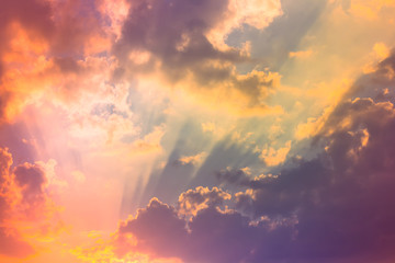 Many color sun rays light in sky with clouds