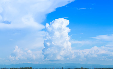 tower clouds in blue sky and landscape