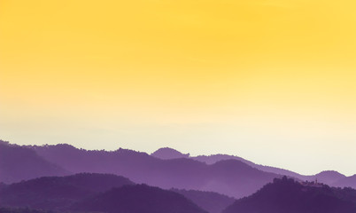 Fototapeta na wymiar purple mountain with yellow blank sky