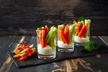The sticks of carrots and celery with sauce, healthy snacks