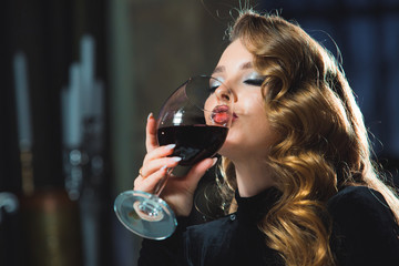 beautiful girl is having dinner at a restaurant.