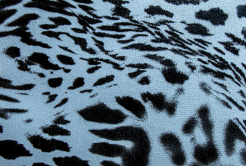 Artificial black and white leather. Faux leather texture close-up. Imitation of black spots