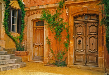 Fototapeta na wymiar House finished in the traditional Ochre in the hilltop village of Roussillon in the Luberon Provence France
