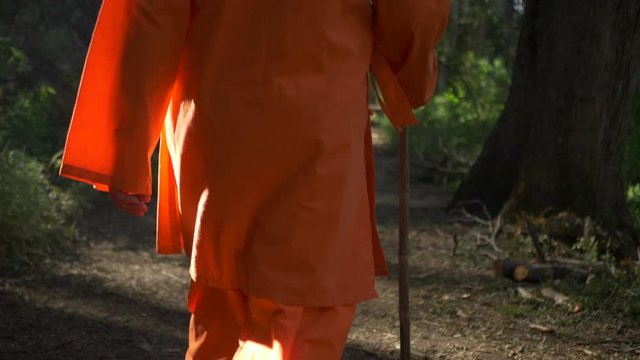 Man Dressing as a Monk walking