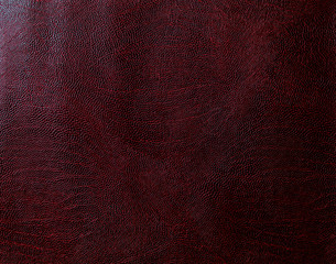 Maroon faux leather. Artificial leather texture