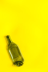 Fototapeta premium Empty bottle on yellow background top view copy space