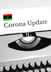 A Typewriter Typing the NEWS of COVID-19 with the Flag of Libya.