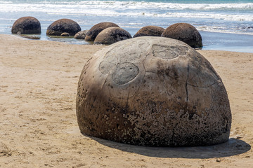 Spherical rocks at Moeraki Boulders beach in New Zealand.