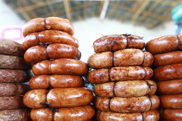 Fried sausage rolls in market