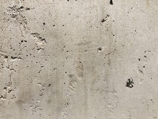 cracked concrete wall covered with cement surface as background