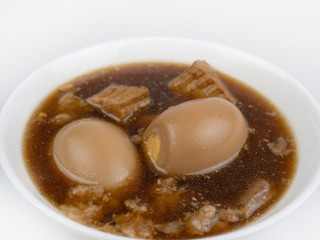 Egg and Pork in Sweet Brown Sauce(Khai Palo)Egg  on white background, stewed eggs in brown sauce by Thai food