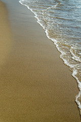 Soft wave of the sea on the sandy beach