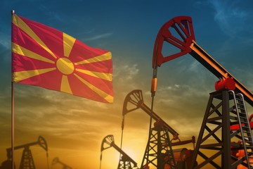 Macedonia oil industry concept. Industrial illustration - Macedonia flag and oil wells against the blue and yellow sunset sky background - 3D illustration
