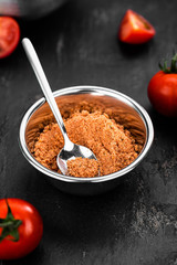 Portion of Tomato Powder (close up; selective focus)