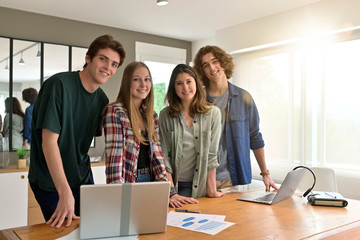 Group of students standing in office