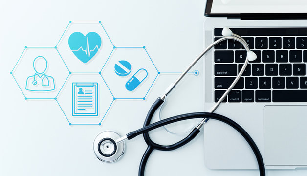 Healthcare Technology And Telemedicine Concept. Stethoscope And Laptop On White Background.