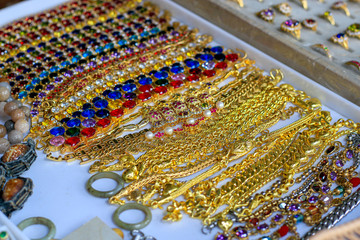 Close-up of a gold chain and jewelry.