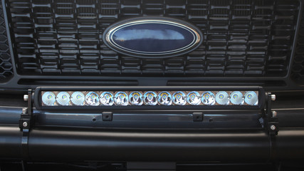 Long bar LED lights installed in front of the grill of a ute (pick up truck)