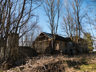 Fototapeta na wymiar an abandoned ruined country house