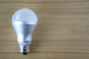 light bulb on a wooden background