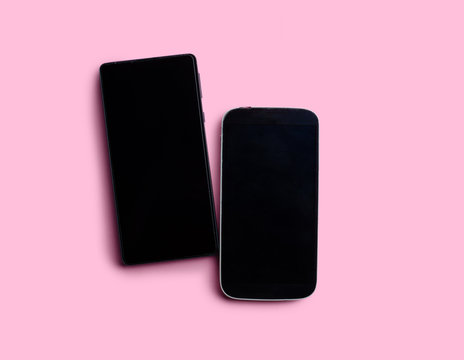 two phones on a colored background top view love letters two hearts