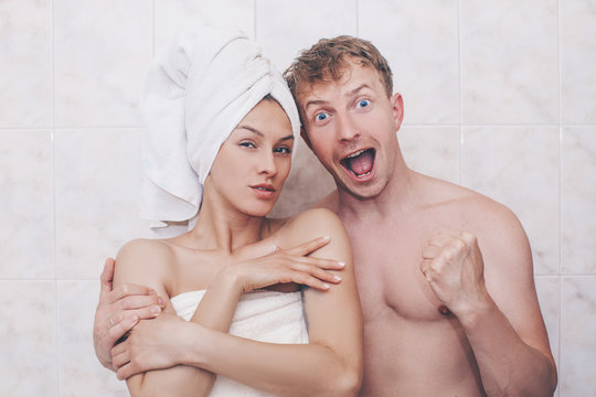 Portrait of happy young couple cuddling in the bathroom. Sensual. Sexy photo. Eroica. Funny photo. Sexual. 
