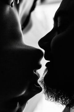 The silhouettes of kissing couple. Stay home