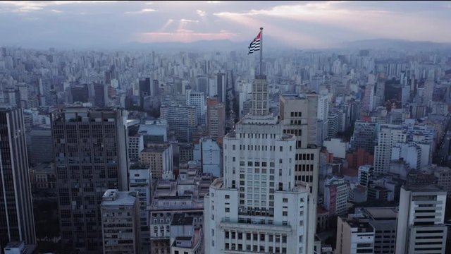 Aerial view of Altino Arantes building, called Banespao with the flag fluttering, Sao Paulo downtown, Brazil