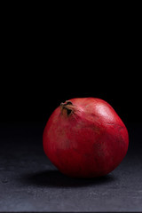 Fototapeta na wymiar pomegranate on black background 