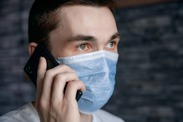 guy in medical mask on quarantine self-isolation