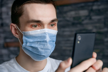 guy in medical mask on quarantine self-isolation