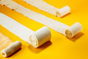 Elastic bandages on top of colorful background.