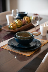 a set of blue plate and bowl on the dining table