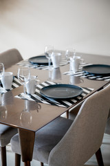 Beautiful dining table setup with blue plate