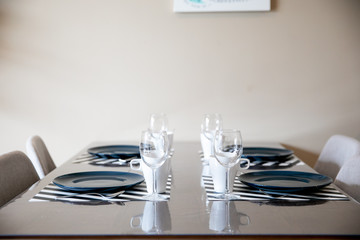 Beautiful dining table setup with blue plate