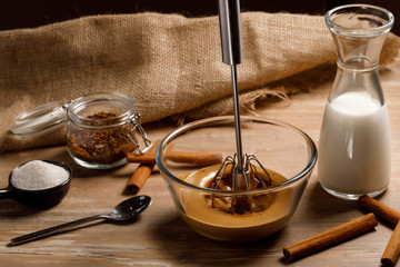 Cooking step by step Korean Dalgona coffee. Whipping coffee, water and sugar. Step 3.