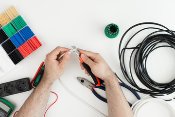 Electric stripper end wire, close-up, flat lay