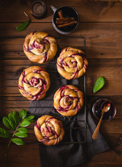 Currant Pies on wooden background. Top view. Low key.