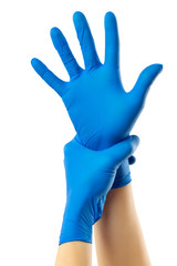 Female hands. Doctor is putting on protective medical gloves, isolated on white. Concept of coronavirus protection.