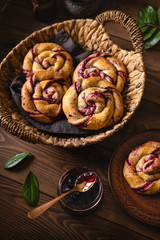 Currant Pies on wooden background. Top view. Low key.