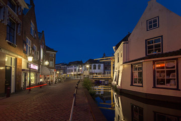Fototapeta na wymiar City of Schiedam at night. Twilight. Draw bridge and canal