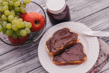chocolate paste toast with banana for Breakfast, fruit