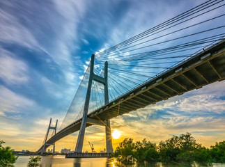 Beautiful sunset landscape at Phu My Bridge. This largest cable-stayed bridge crossing Saigon river connect District 2 and 7 in Ho Chi Minh City, Vietnam