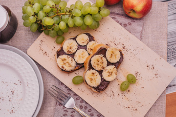 chocolate paste toast with banana for Breakfast, fruit